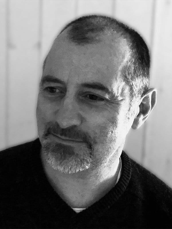 A black and white photo of Ewan Colville of Red Sky at Night Events