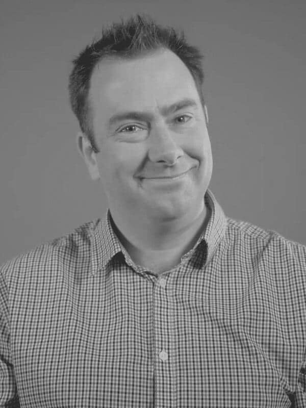 A black and white photo of Roddy Scott of Red Sky at Night Events