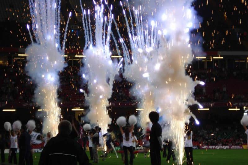A photo of fireworks and cheerleaders as the teams run out during the Rugby Football League Magic Weekend 2010